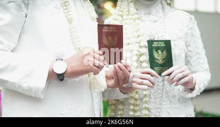 Jakarta, Indonesia, October 9th 2022 : Akad Nikah also known as marriage moment and ceremony , Indonesian Marriage called Ijab Qobul. Stock Photo