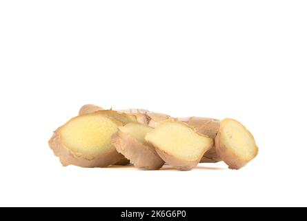Ginger root with pieces cut off from it on a white background. Copy space. Stock Photo