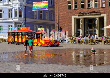 Summer tourist scene typical for the vacation season on the Old Market Square, Hanseatic Town of Stralsund, Mecklenburg-Western Pomerania, Germany. Stock Photo