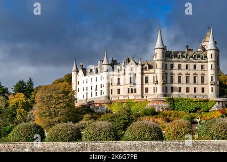 Dunrobin Castle Golspie Sutherland Scotland the castle building the garden wall and trees in autumn colours Stock Photo