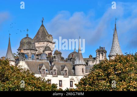 Dunrobin Castle Golspie Sutherland Scotland trees in autumn and the towers and fairy tale spires of the building Stock Photo