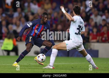 Barcelona, Spain, 12th October 2022. Ousmane Dembele of FC Barcelona takes on Matteo Darmian of FC Internazionale during the UEFA Champions League match at Camp Nou, Barcelona. Picture credit should read: Jonathan Moscrop / Sportimage Stock Photo