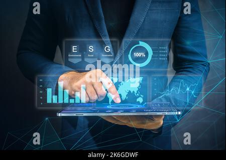 Businessman working at modern office. modern virtual interface. Digital diagram, graph interfaces, virtual screen. Man using modern tablet for busines Stock Photo