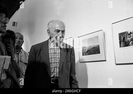 André Kertesz, Hungarian photographer, reviews his last exhibit at the