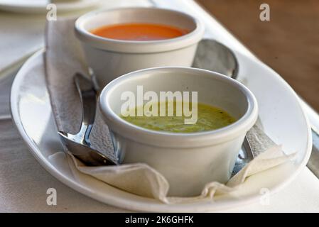 Traditional Spanish food mojo rojo and mojo verde - Typical red and green mojo dips to accompany food in Tenerife, Canary Islands, Spain Stock Photo