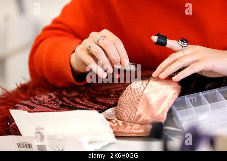 Cologne, Germany. 14th Oct, 2022. Dressmakers prepare the costumes for the musical 'Moulin Rouge'. The play will premiere on November 6. Credit: Thomas Banneyer/dpa/Alamy Live News Stock Photo