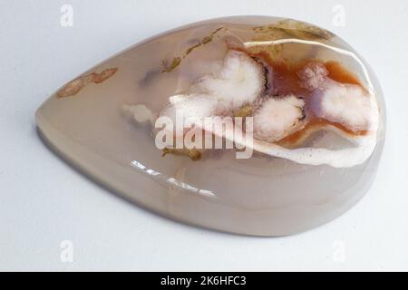 Flower dendritic agate chalcedony cabochon gem on white background macro Stock Photo