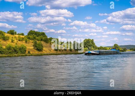 Barge on the Rhine–Main–Danube Canal in an idyllic valley (Bavaria, Germany) Stock Photo