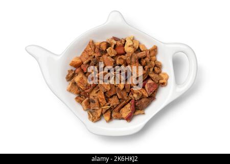 Dried apple pieces on a bowl close up to make apple tea isolated on white background Stock Photo