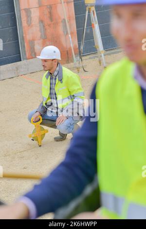 a man is using a geometers Stock Photo