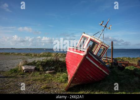 Faulmore, Co. mayo, Ireland, 09-13-2019. Boat on shore at blacksod pier. Stock Photo