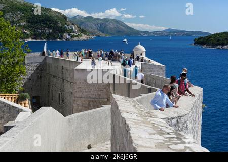 Dubrovnik city walls with tourists Stock Photo