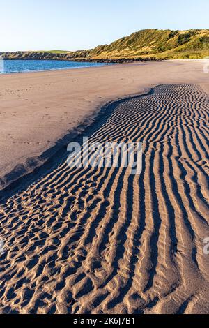 Evening light on patterns in the sand at Ardwell Bay, Dumfries & Galloway, Scotland UK Stock Photo