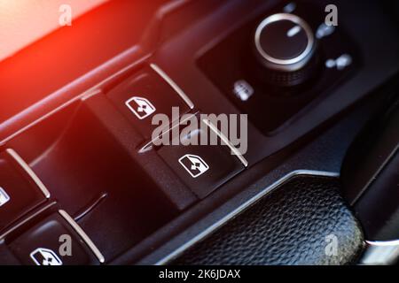 power window control buttons in the car close-up. Stock Photo