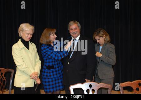 Secretary's Open Forum session in Dean Acheson Auditorium, featuring discussion of the new book from the Geneva Center for the Democratic Control of Armed Forces, "Women in an Insecure World." Panelists included Under Secretary for Global Affairs, Paula Dobriansky; the Geneva Center Director, Theodor Winkler; and Harriet Babbitt, former Deputy Director of the U.S. Agency for International Development, former U.S. Ambassador to the Organization of American States, current official of the organization, Women Waging Peace. Stock Photo