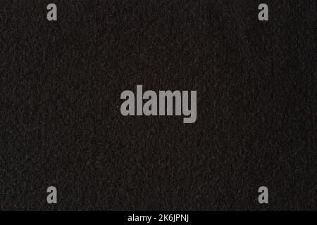 Black color felt textile fabric texture background. Top view Stock Photo