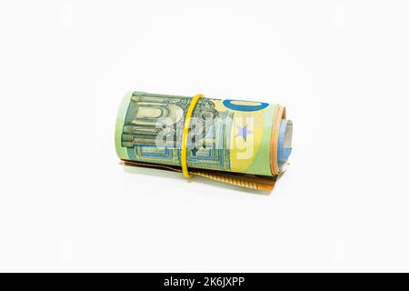 Roll of Euro notes in the elastic band. EU banknotes in a money roll Stock Photo