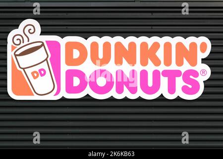 Wasserbillig, Luxembourg- March 24, 2015: Dunkin' Donuts sign on a wall. Dunkin' Donuts is an American global doughnut company and coffeehouse chain Stock Photo