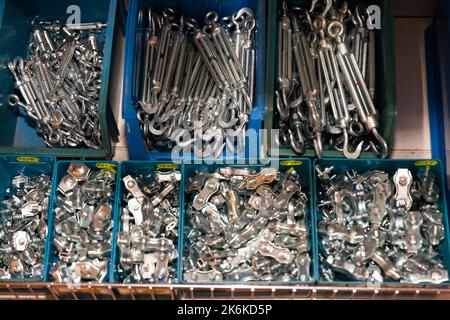 Boxes with building hardware in a hardware store Stock Photo