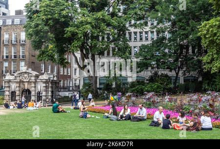 People in Victoria Embankment Gardens London UK Stock Photo