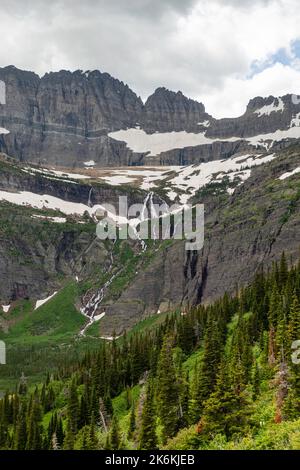 Photograph of the the Garden Wall and the shrinking Grinnell Glacier from the Grinnell Glacier Trail on an overcast day. Glacier National Park, Montan Stock Photo