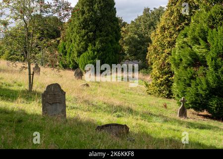 Radnor Street cemetery picturesque old cemetery with fallen gravestones in Swindon, UK Stock Photo