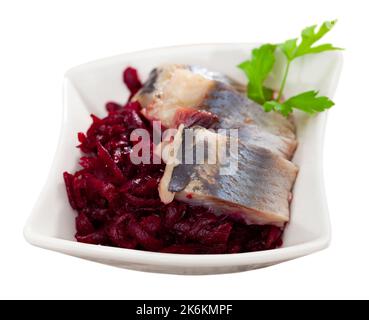 Sliced herring with grated beetroot served on table Stock Photo