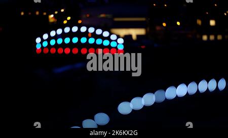 Abstract dark background. Blurred lights of the night city. Bokeh abstract. Stock Photo