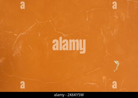 orange background of an old plastered wall in sunlight Stock Photo