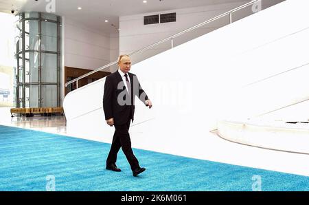 Astana, Kazakhstan. 14th Oct, 2022. Russian President Vladimir Putin arrives to attend the meeting of the Commonwealth of Independent States (CIS) summit in Astana, Kazakhstan on October 14, 2022. President Vladimir Putin told the media after the (CIS) meeting on friday that Russia doesn't have plans to expand military mobilisation and warns that a direct clash with NATO would lead to a 'global catastrophe.' Photo by Kremlin Pool/UPI. Credit: UPI/Alamy Live News Stock Photo