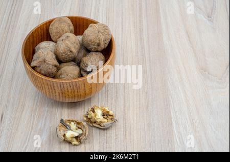 Hazelnuts in a bowl on the table Stock Photo