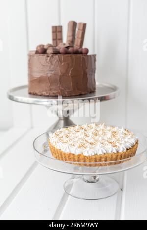 appetizing chocolate and cream pie cakes, ready-to-eat and decorated desserts, sweet food Stock Photo