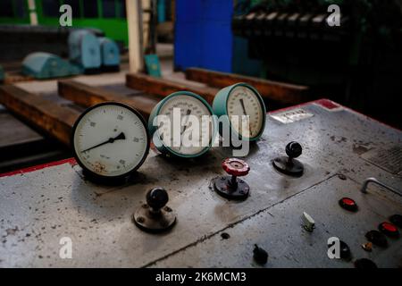 Control panel with buttons and pressure gauge Stock Photo