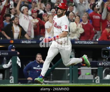 Philadelphia Phillies' Bryce Harper (3) reacts after Nick Castellanos (8)  hit a two-run home run during the first inning a spring training baseball  game against the Baltimore Orioles, Monday, March 28, 2022