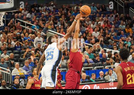 Orlando, Florida, USA, October 14, 2022, Cleveland Cavaliers Guard Nate Hinton #14 and Orlando Magic Small Forward Admiral Schofield #25 fight for the ball in the second half at the Amway Center. Credit: Marty Jean-Louis/Alamy Live News Stock Photo