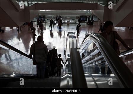 Silhouettes of passengers in terminal Haneda Airport Tokyo Japan Stock Photo
