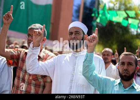 Gaza, Palestine. 14th Oct, 2022. Palestinian supporters of the Palestinian Hamas movement chant slogans during a demonstration in support of Al-Aqsa Mosque in Khan Yunis in the southern Gaza Strip. (Photo by Yousef Masoud/SOPA Images/Sipa USA) Credit: Sipa USA/Alamy Live News Stock Photo