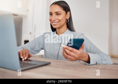 Shes a boss lady. a young businesswoman using a laptop in an office at work. Stock Photo