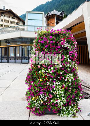 Ischgl, Austria - July 25, 2022: Floral decoration in front of Cultural center Saint Nicholas in Ischgl. Stock Photo