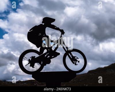 Timmelsjoch, Austria - July 26, 2022: Silhouette of a cyclist on the Timmelsjoch mountain pass in the Tyrol between Austria and Italy Stock Photo
