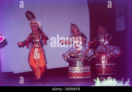 Manipuri:- Is characterized by variety of forms that are linked to Folk Tradition and rituals, Themes are generally taken from episodes in the life of Krishna, the pastoral god. During dance narrator may chant dialogue and characteristic singing. Manipuri is smooth graceful steps being light and close to floor. A flowing sway of body and liquid movements of arms & hands. Stronger and more forceful movements are used by Man. Stock Photo