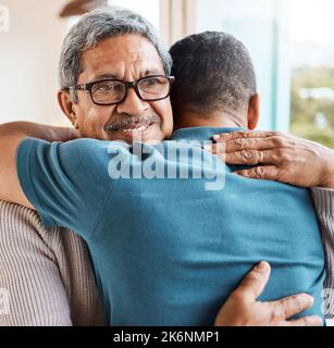 You can always find comfort in my arms. a father and son hugging at home. Stock Photo