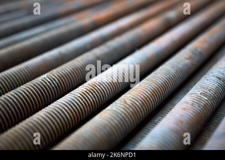 Condensing unit steel close up wire finned obsolete table grill perspective texture, compressor and air conditioning system. Selective focus Stock Photo