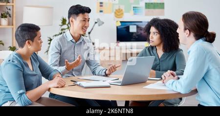 Strategy, planning and employees meeting about a business project in an office together at work. Asian manager talking to team of workers about idea Stock Photo