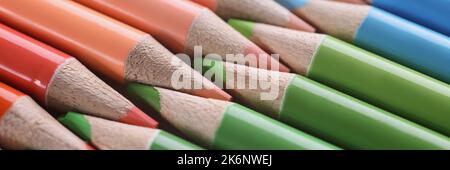 Macro sharpened red green blue pencils, blurry Stock Photo