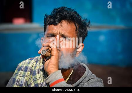 Young Rural Smokers Young indian man smoker portrait in black t shirt and silver neck chain ...