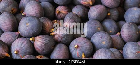 many fresh figs on a pile at market Stock Photo