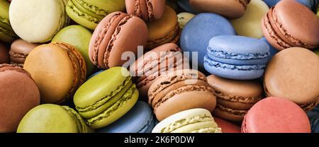 pile of colorful macarons dessert, in vintage pastel tones Stock Photo