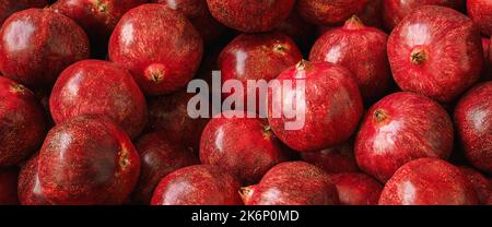 Pomegranate garnet fruit at a pile on a market Stock Photo