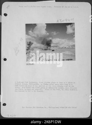 A Japanese zero fighter plane, shot down during World War II, lies on a ...